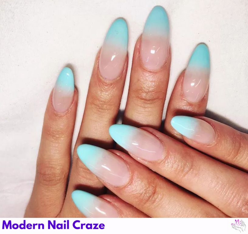 Soft ombré blue French nails with a modern, artistic effect.