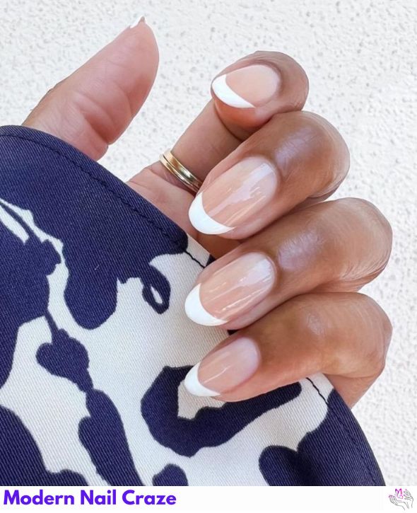 Timeless French manicure with white tips and a nude base.