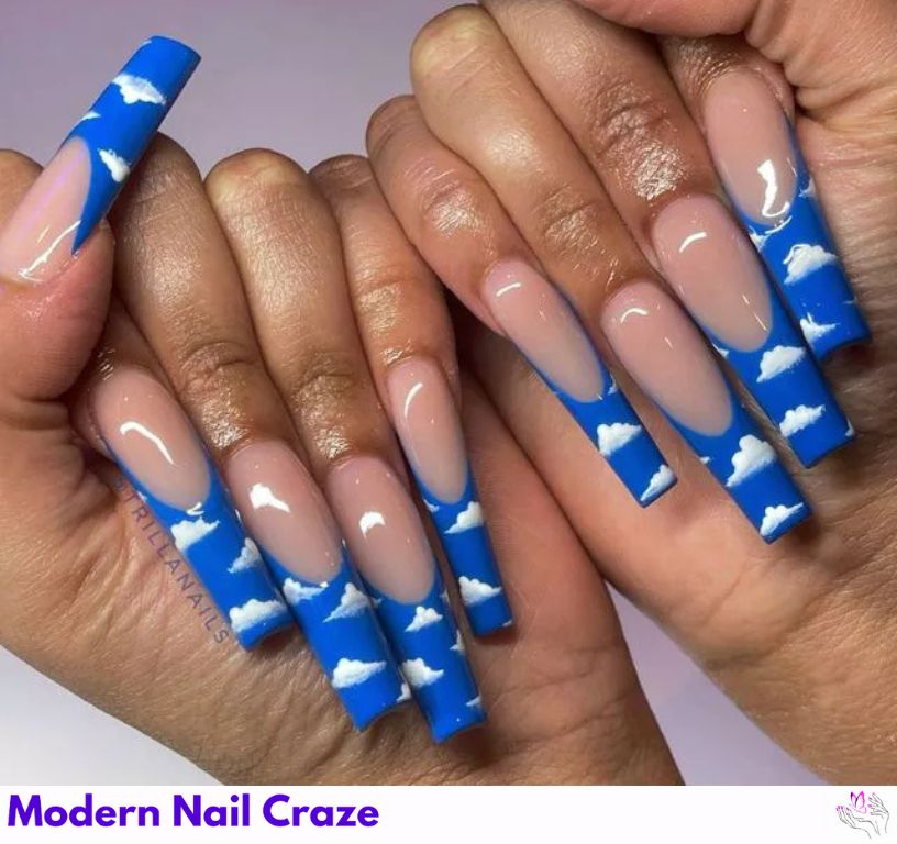 Cool Clouds – Airy blue French nails decorated with fluffy white clouds.