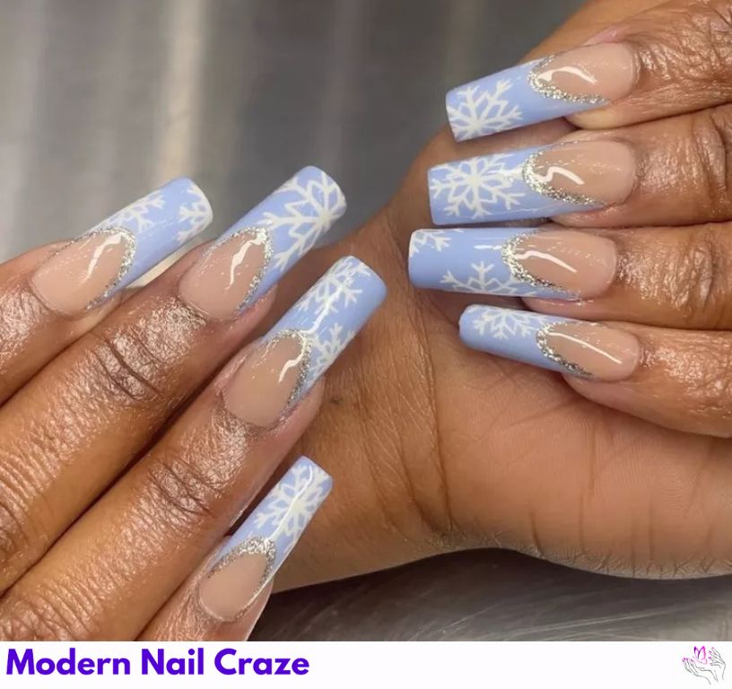 Frosted Tips – Wintery blue French nails with delicate snowflake accents.