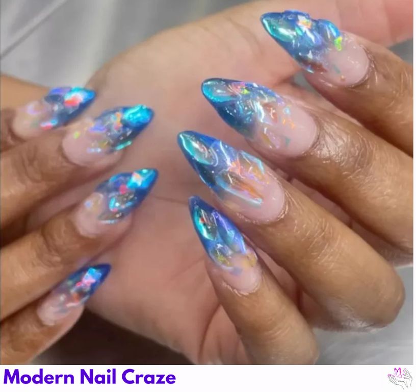 Glacial Blue – Frozen-inspired blue French nails with 3D chrome and glitter.