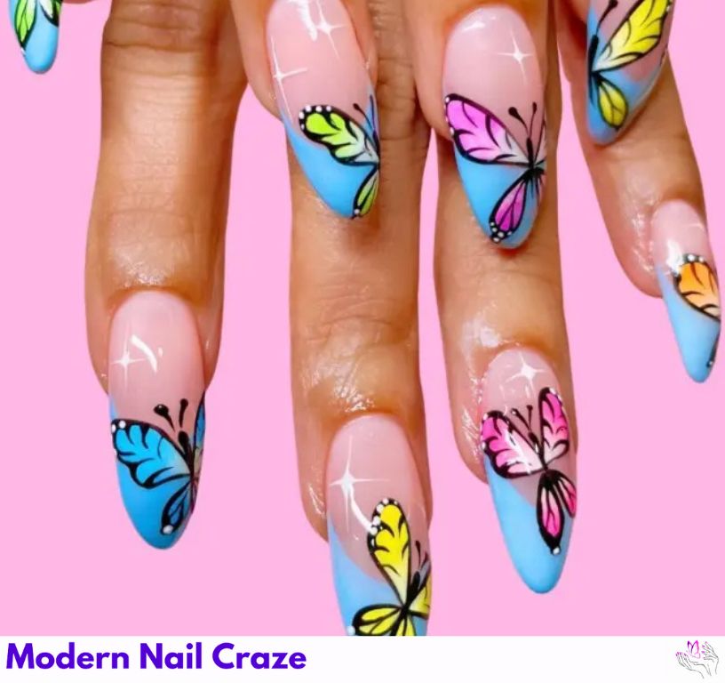 Magical blue French nails with star and butterfly decorations.