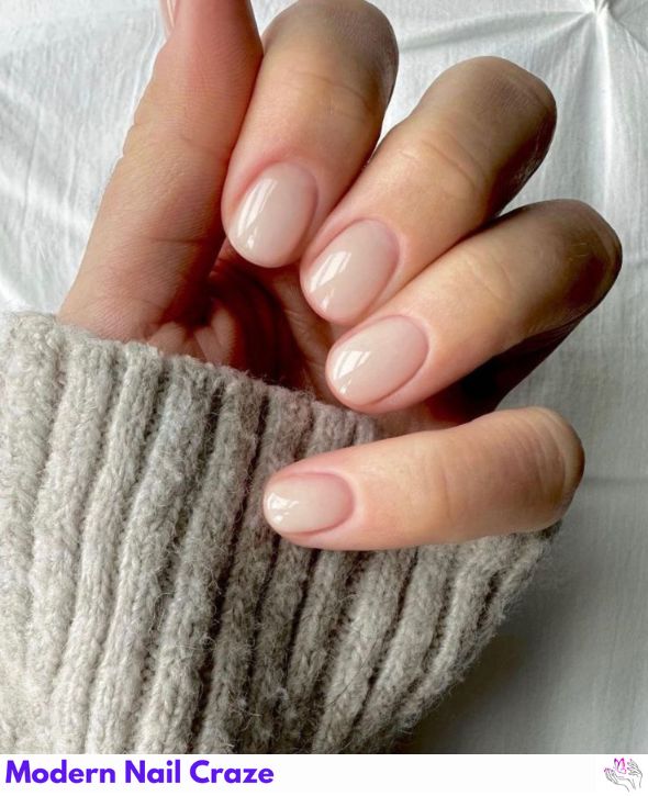 Sheer milky white nails with a glossy finish.