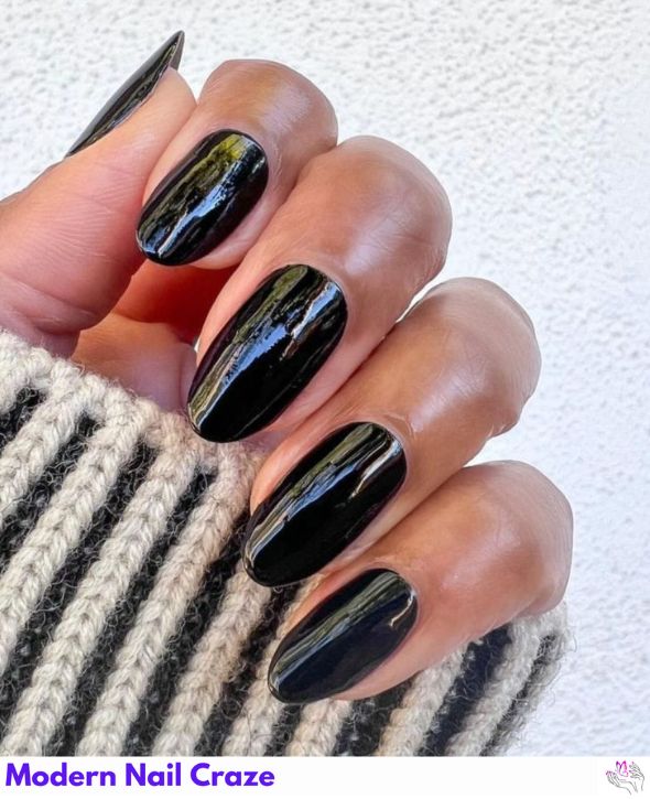 Solid glossy black nails with a bold, sleek look.