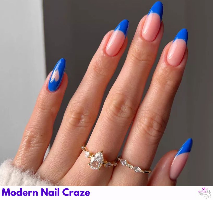 Bold blue French nails with a royal touch and elegant details.
