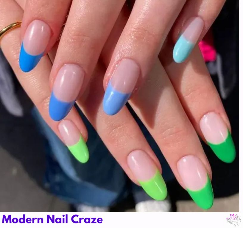 Multi-tone blue French nails with a colorful mix of shades.
