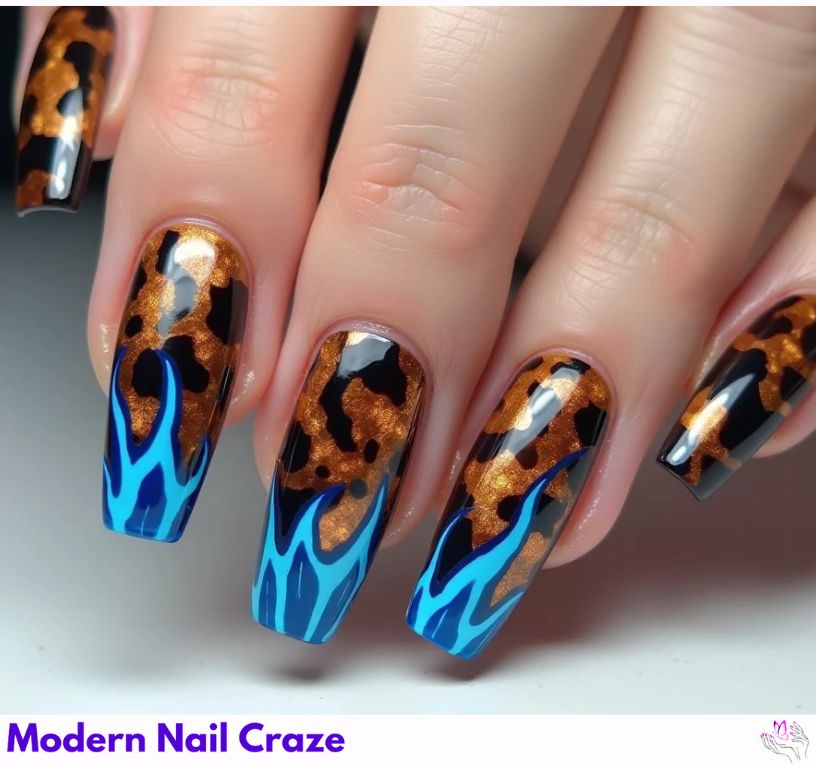Unique blue French nails with tortoiseshell and flame design.