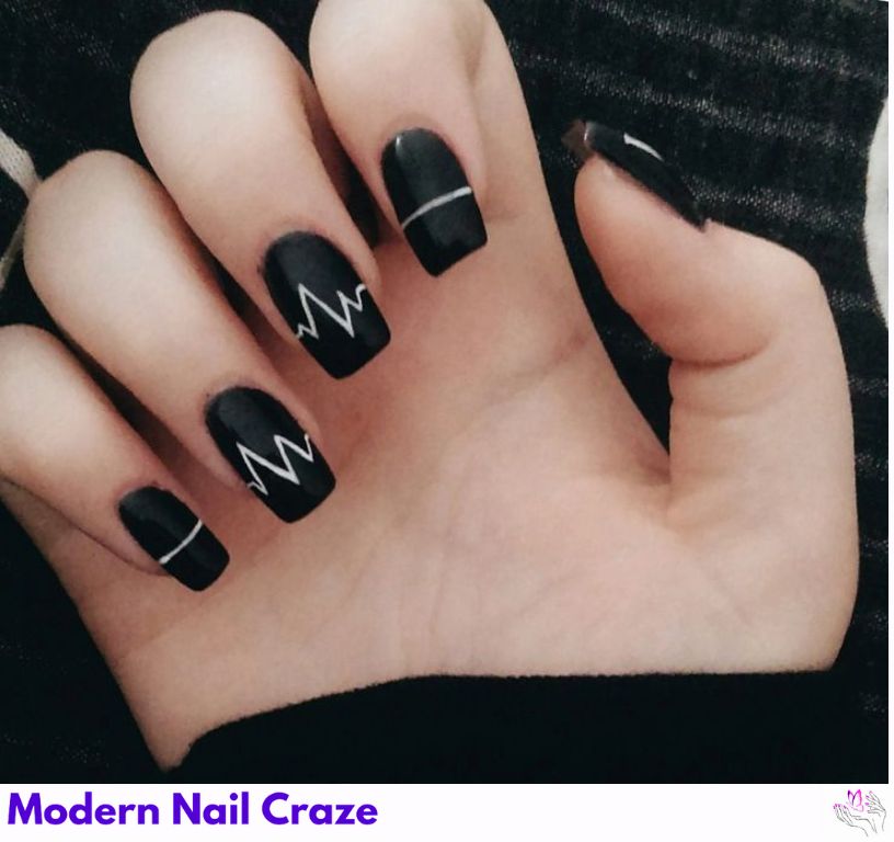 Minimalist matte black nails with design featuring white lines.