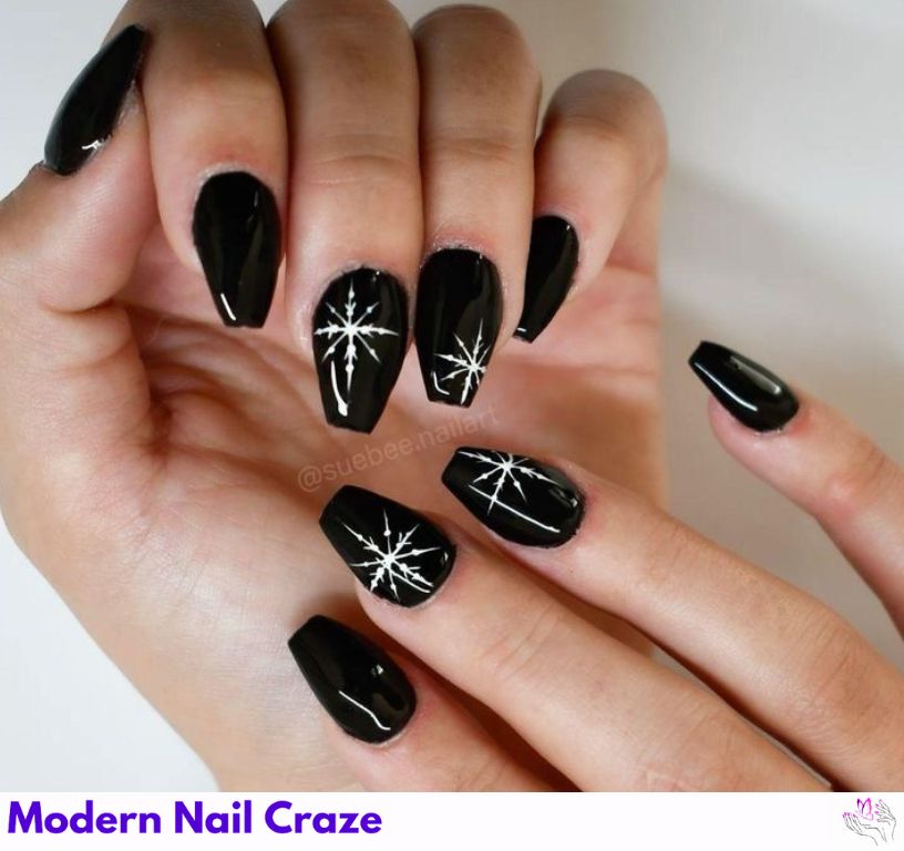 Zodiac-themed matte black nails with design idea.