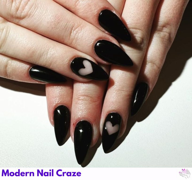 Romantic matte black nails with design featuring mini hearts.