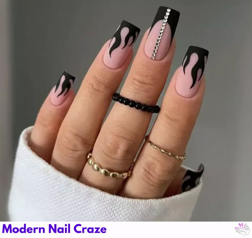 Fiery flame matte black nails with design look.