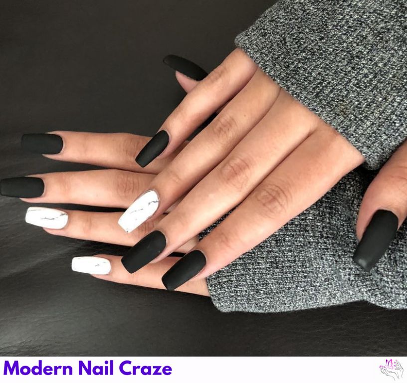 Stylish matte black nails with design featuring a marble effect.