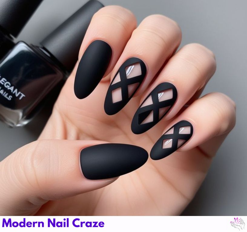 Italicized lettered matte black nails with design.