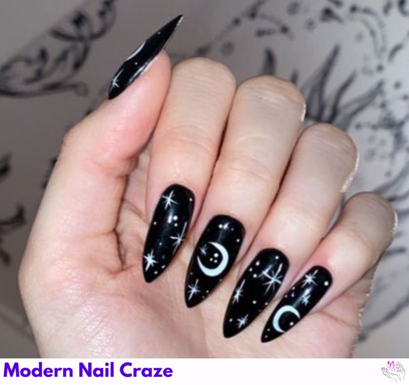 Celestial matte black nails with design featuring moon phases.