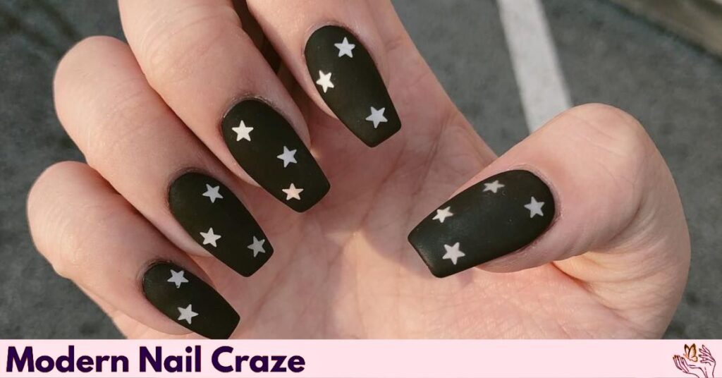 Matte Black Nails with Metallic Stars