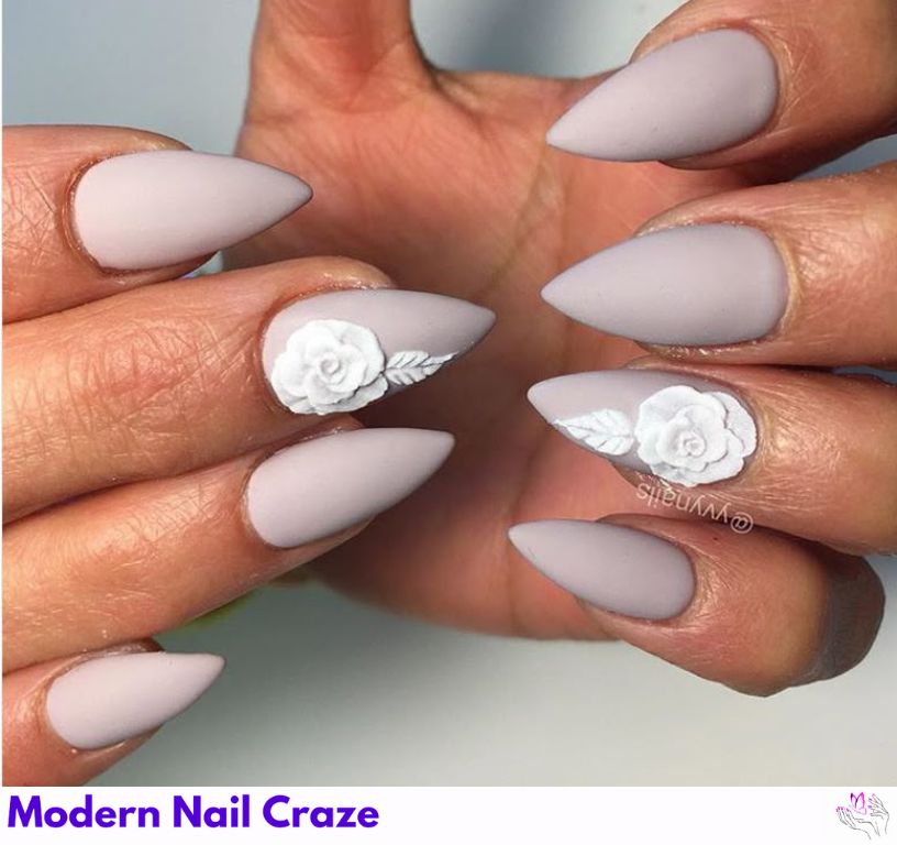 Hand-painted floral short stilettos for feminine, spring-inspired nail look