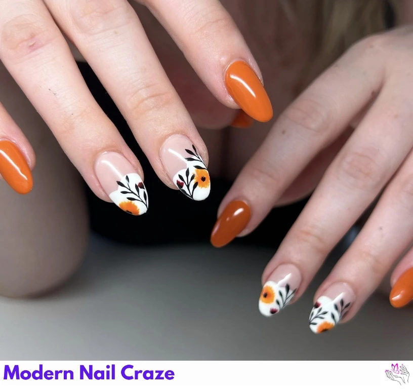 Bright burnt orange nails with crisp white French tips — a seasonal twist on a classic.