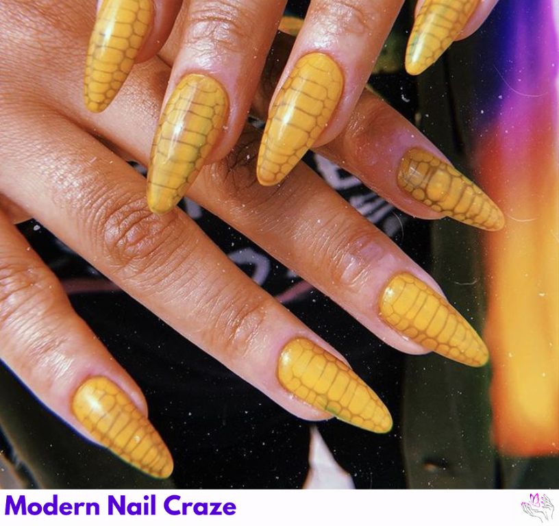Butter yellow snakeskin nails with reptile detailing.