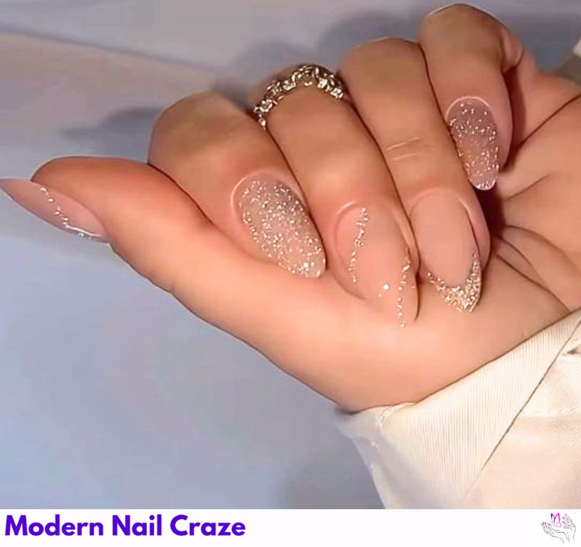 Nude nails with gold champagne glitter tips for a glamorous New Year’s Eve manicure.