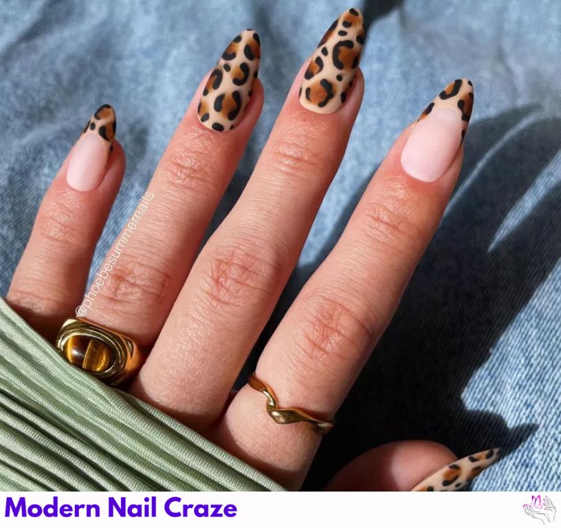 French manicure with sharp cheetah print tips.