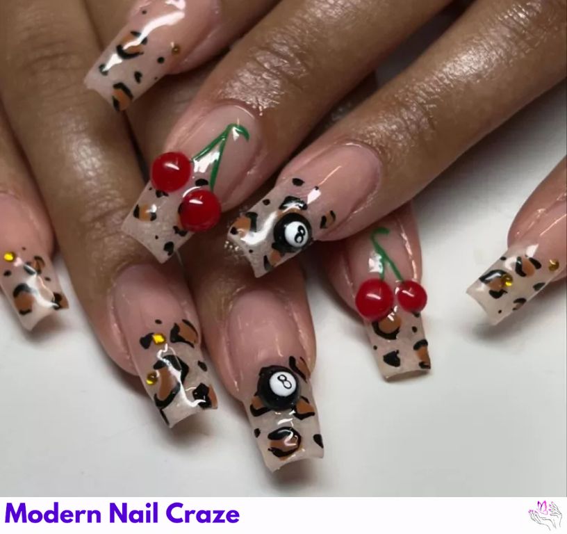 Cute cherry and cheetah nail mix for playful short nails.