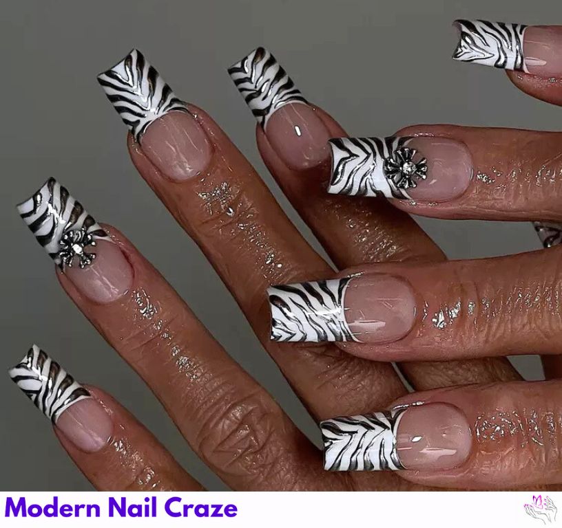 Chrome zebra nails with holographic safari-inspired shine.
