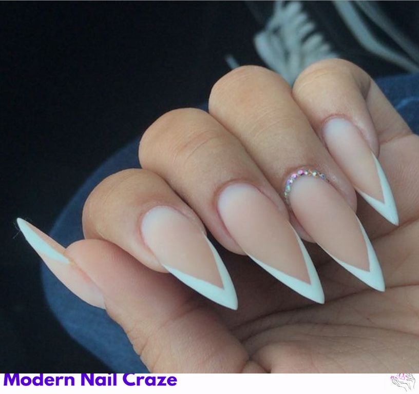 French tip on stiletto nails, timeless look blending softness and bold shape.