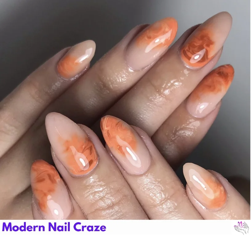 Elegant burnt orange and beige nails — a minimalist autumn nail idea.