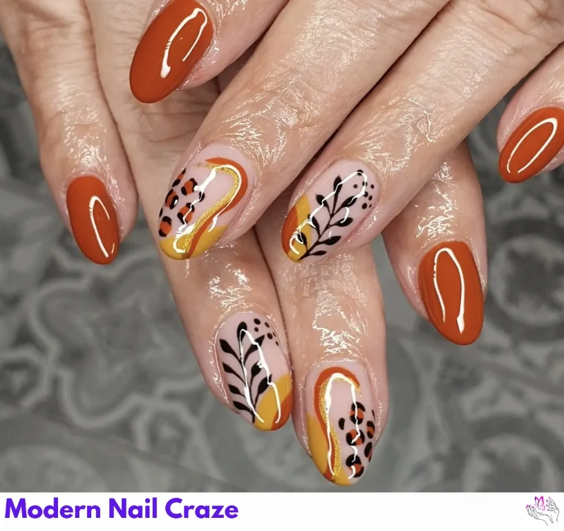 Artistic glossy burnt orange nails with abstract shapes and negative space.