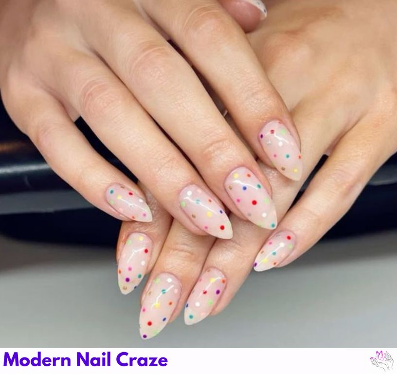 Clear base nails decorated with multicolor foil and glitter confetti for NYE celebration.