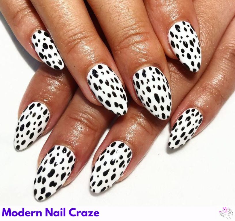 White nails with black Dalmatian spots for a fun theme.