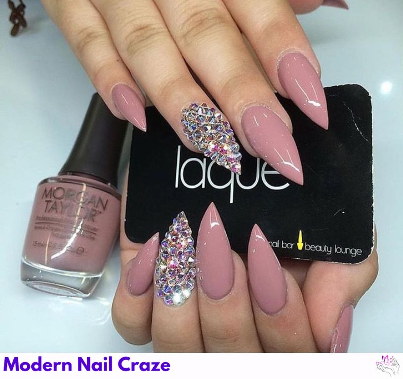 Dusty rose stiletto nails, subtle warmth for fall or rustic weddings.