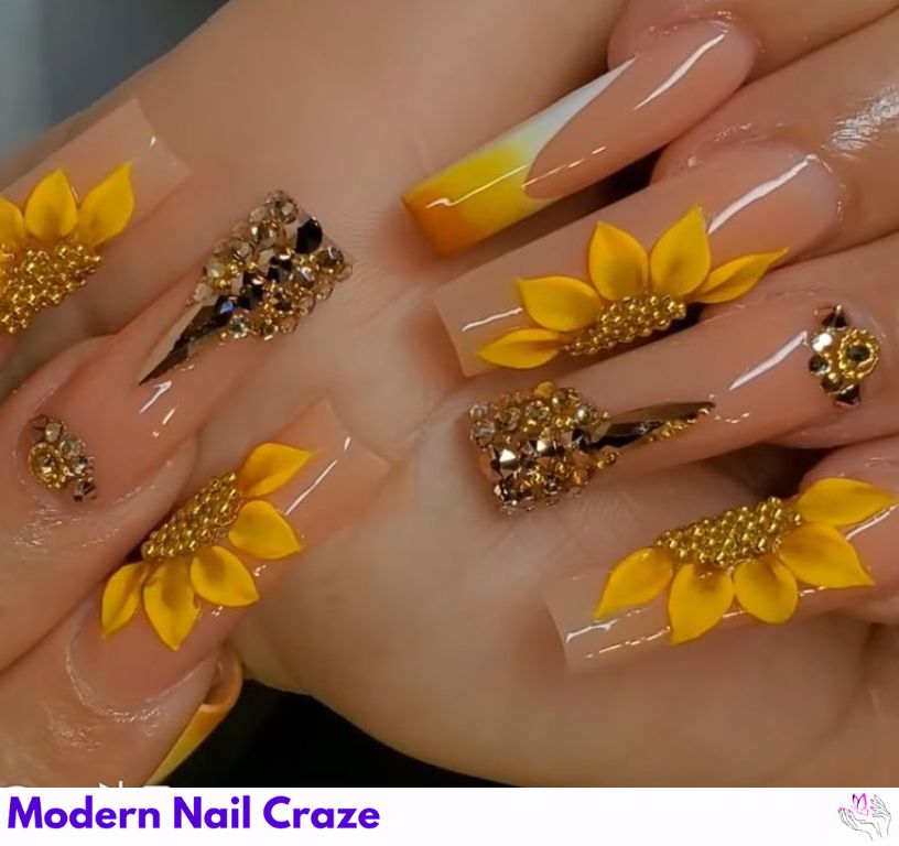 Sunflower nail design featuring gold foil accents for a luxurious finish