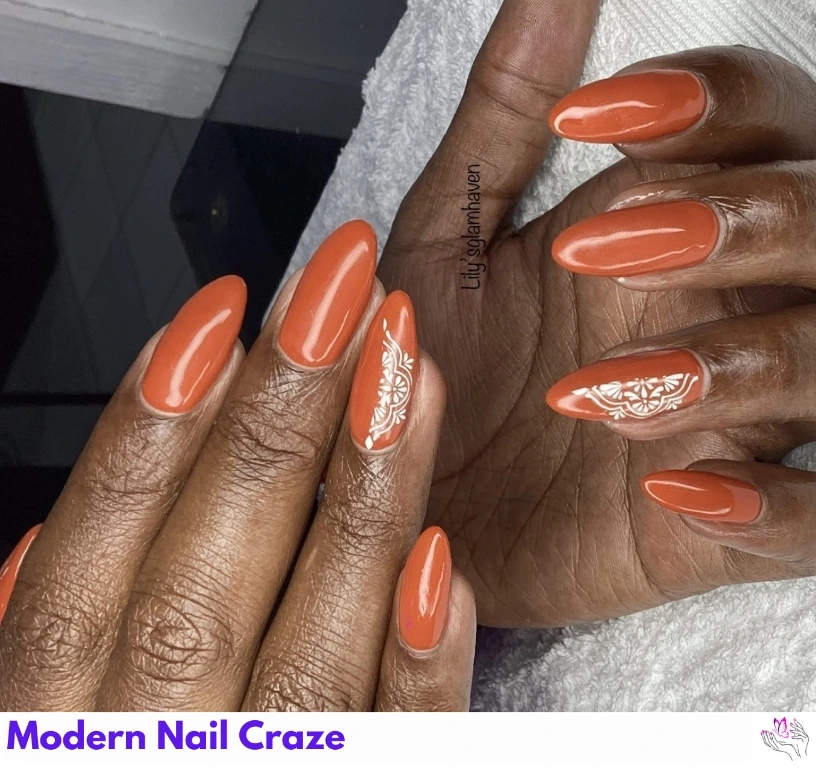 Matte solid burnt orange nails for a minimalist fall nail look.