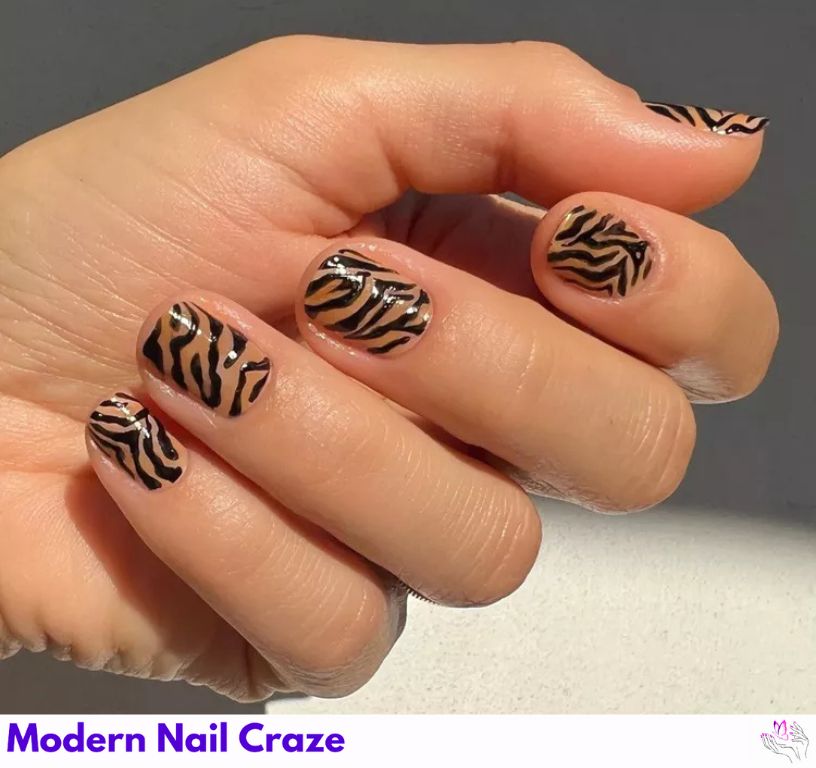 Subtle orange tiger print nails for an understated, classy look.