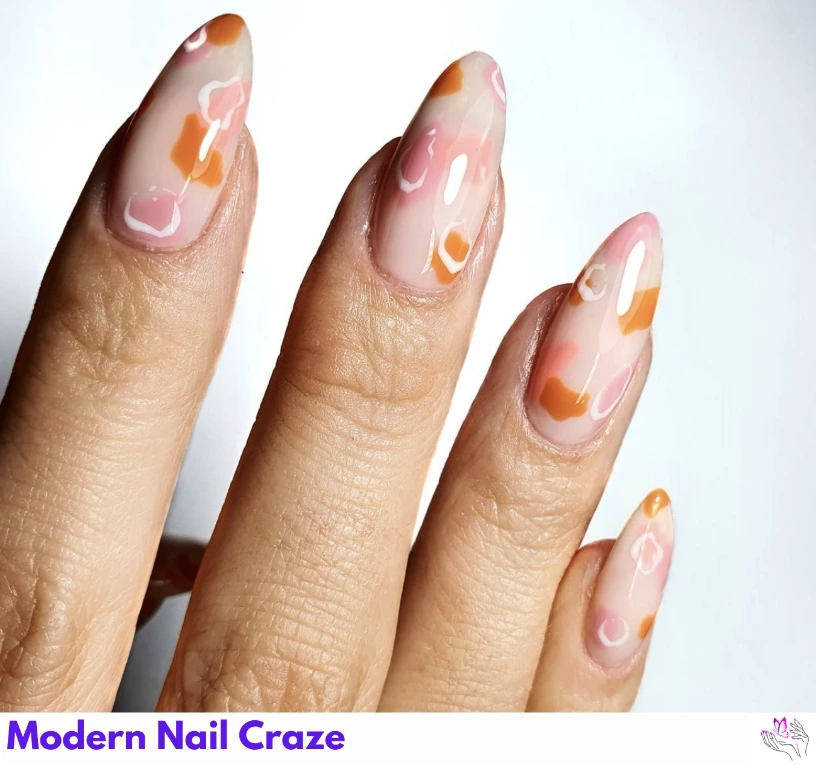 Matte burnt orange celestial nail art with moons, stars, and fine lines.
