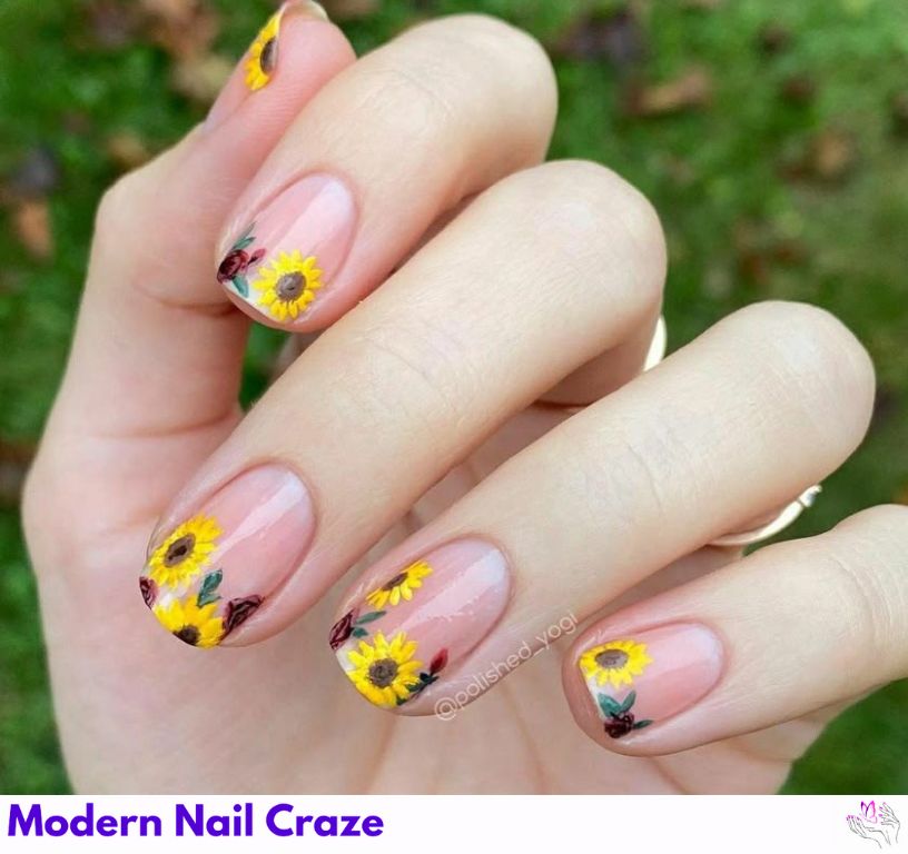 Minimalist sunflower designs on nude or clear nail bases for subtle elegance