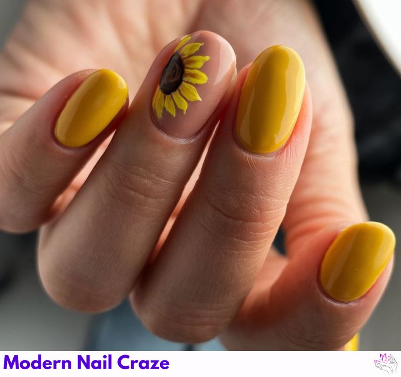 Sunflower nail design with bold yellow base color and detailed floral accents