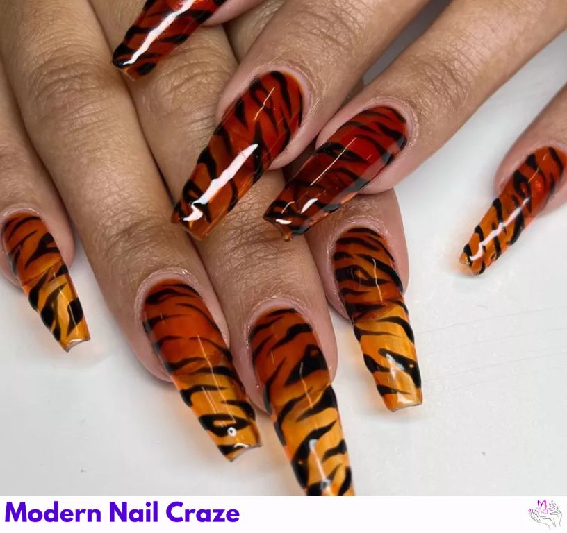 Translucent tiger stripe jelly nails with fierce orange and black accents.