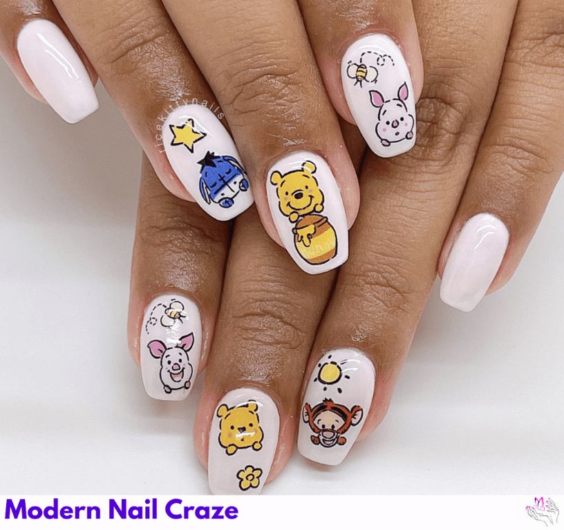 White Base Pooh Nails – Bold white base with colorful Disney friend decals.