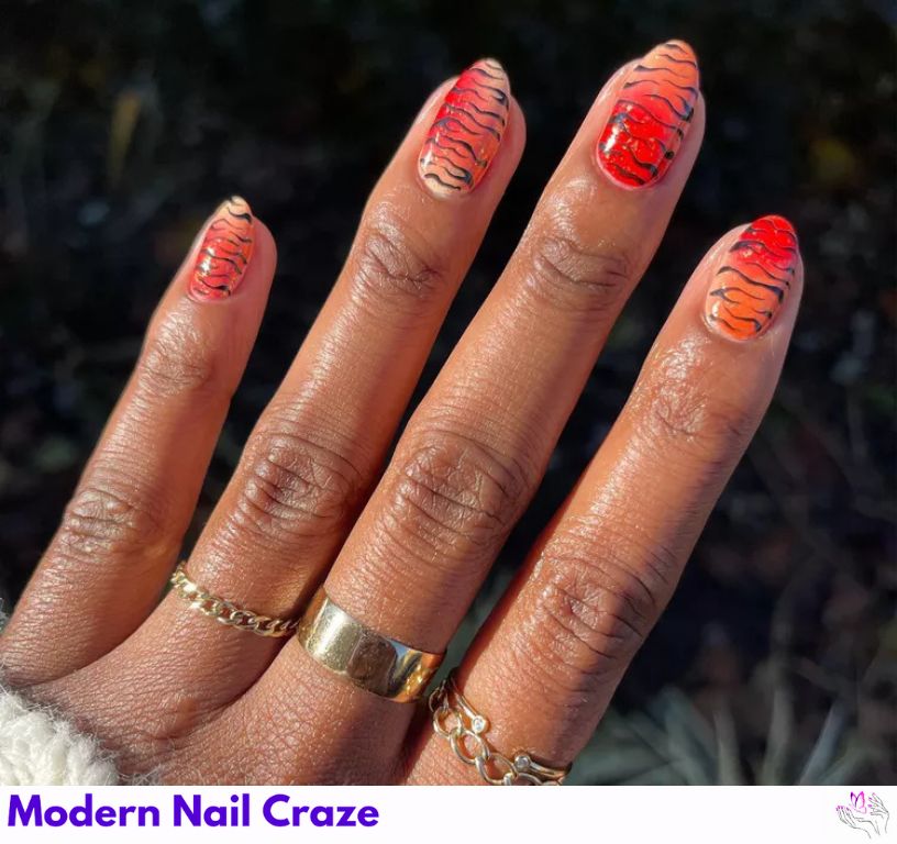 Gradient animal print nail art blending zebra, leopard, and tiger.
