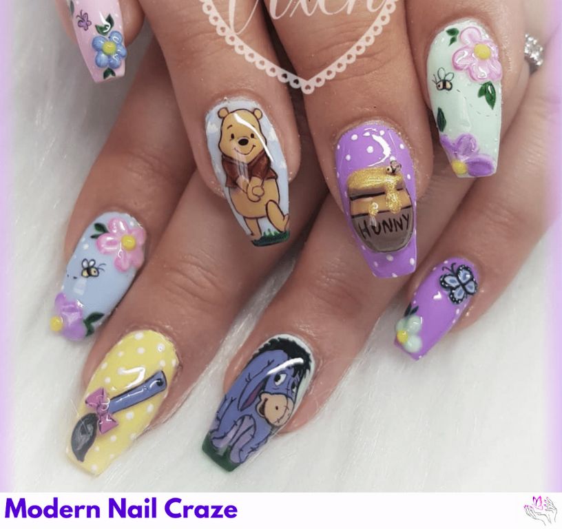 Pastel Pooh & Eeyore Nails – Muted yellow and blue tones featuring dreamy character art.