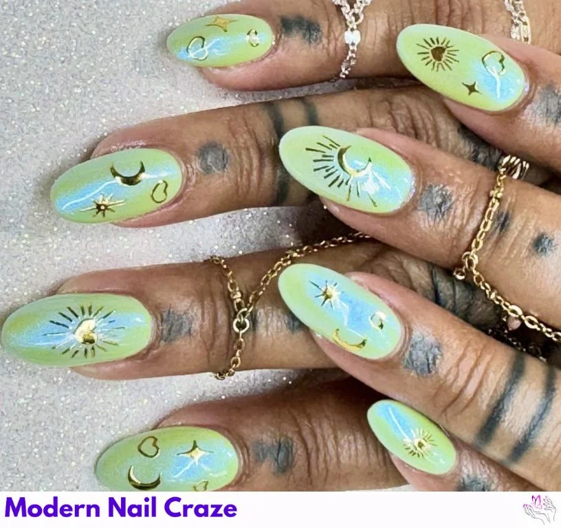 Light pastel celestial nail art with tiny sun and moon decals